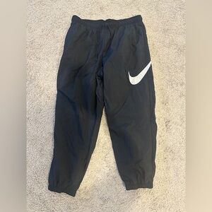 Women's Nike Large Logo Lined Loose Fit Mid Rise Windbreaker Jogger Pant